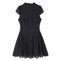 Full front white background shot, black chiffon fitted mini dress with stand collar, cap sleeves and polka dot print