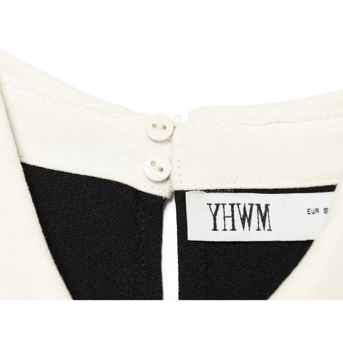 Close-up of back neck buttons and brand label