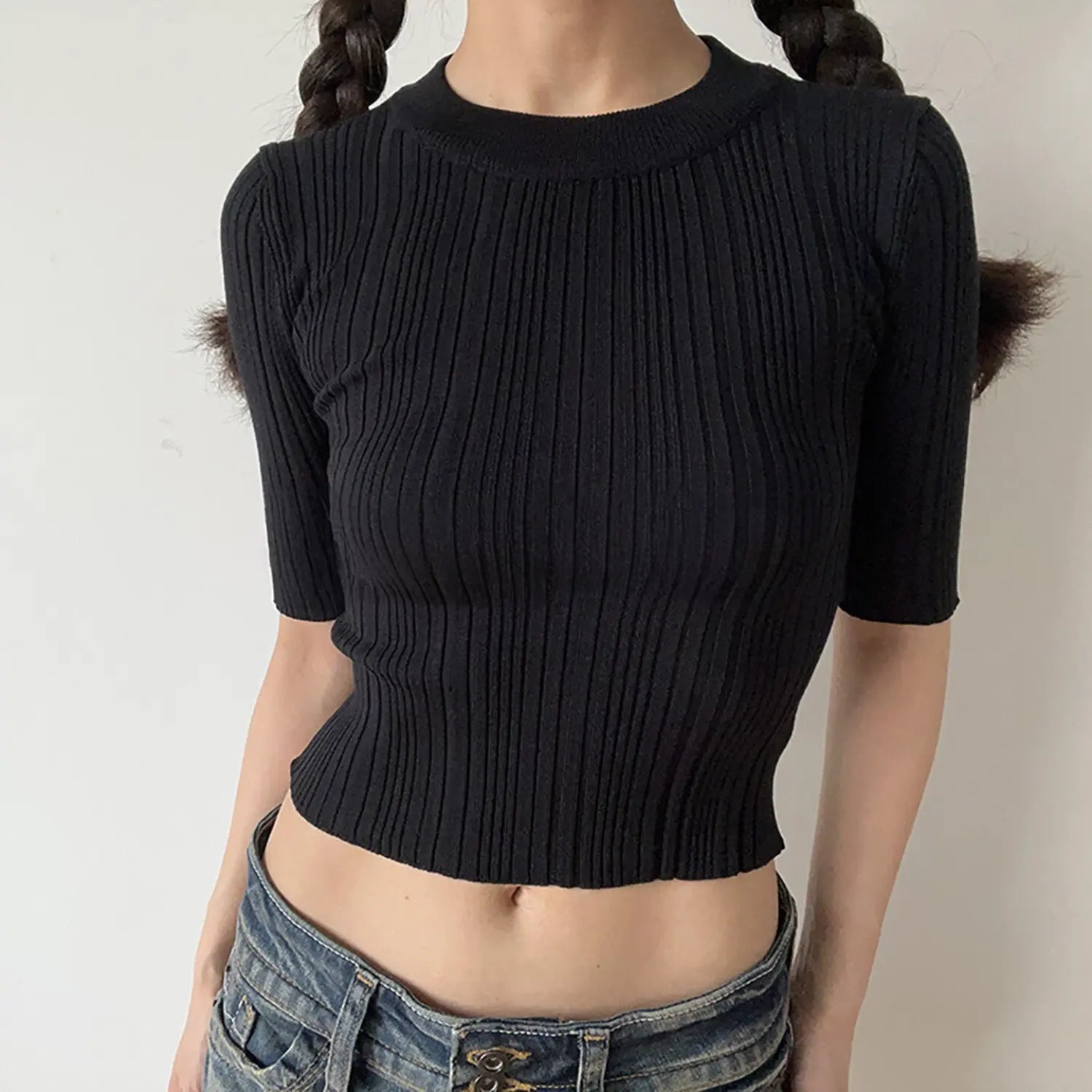 Model front view, black crew neck mid sleeve ribbed knit crop top, tight vertical rib knit cropped shirt