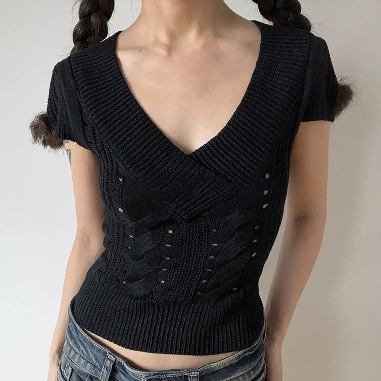 Black deep v neck cable twist knit short sleeve cropped top, slim fitted ribbed hem women casual knit tee studio front view