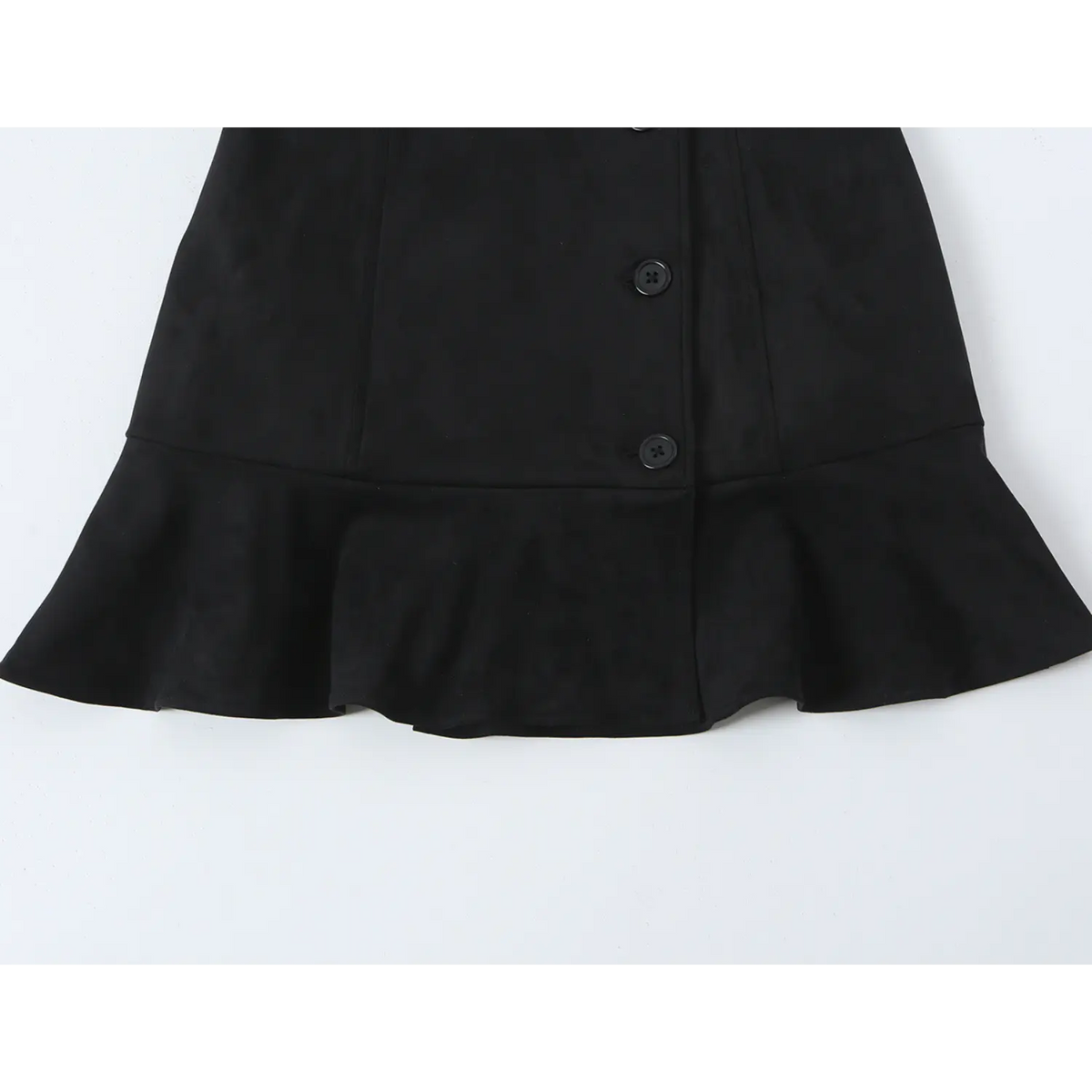 Close-up of ruffle hem and front placket buttons