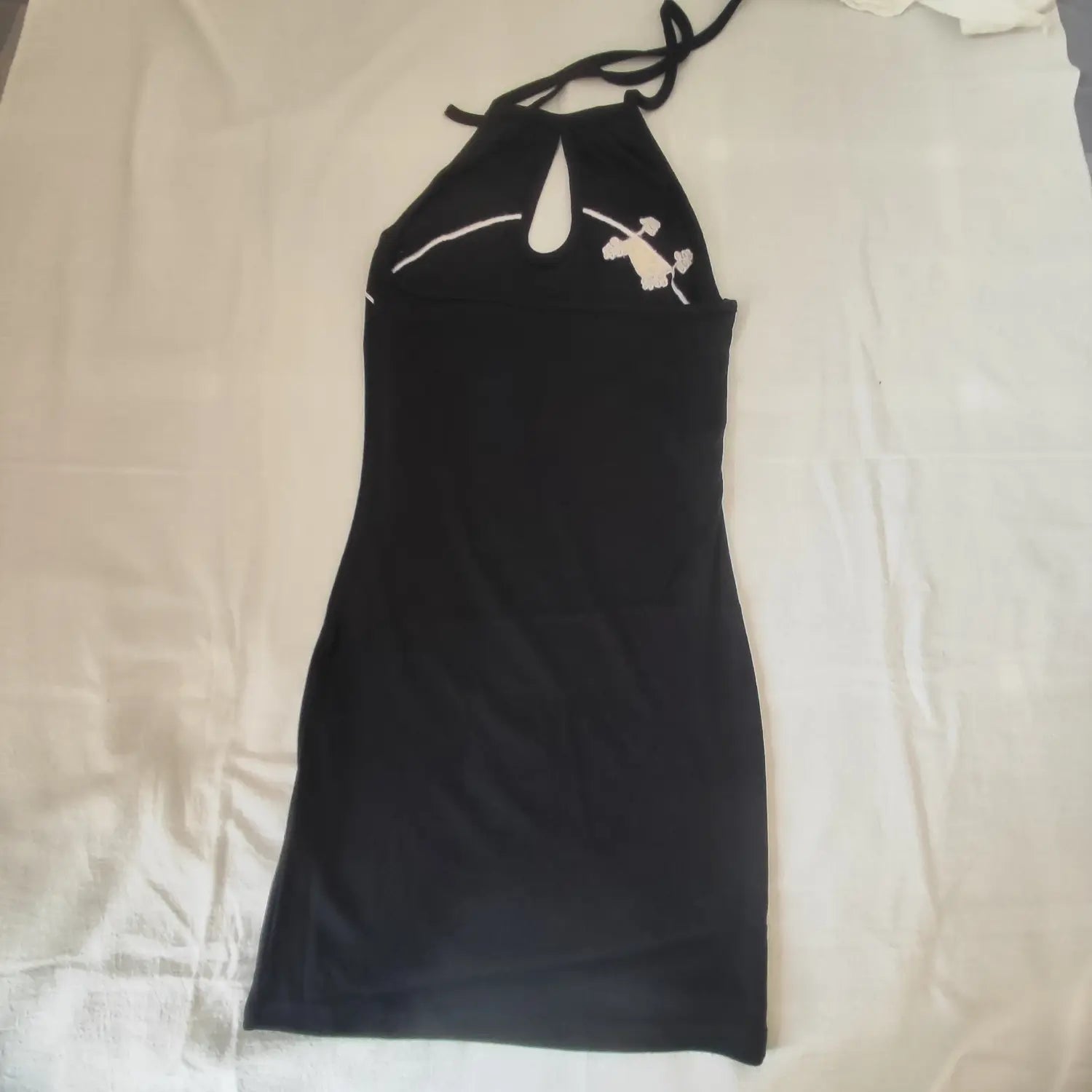 Flat lay full back view black halter tie neck bodycon mini dress
