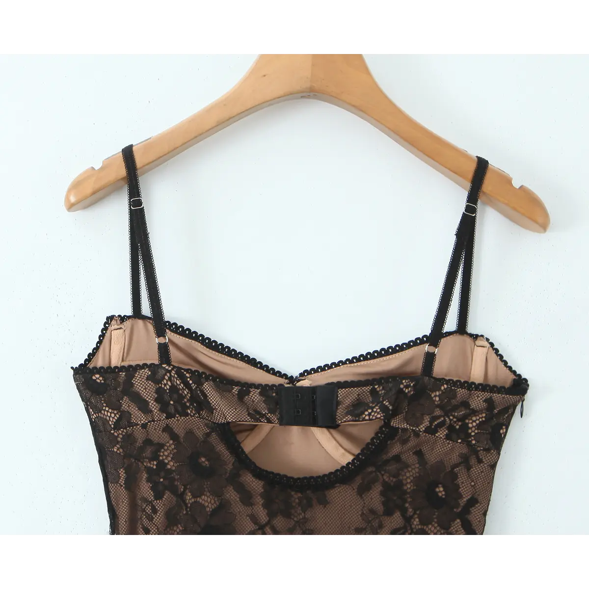 Close-up of the adjustable three-row hook-and-eye closure and double spaghetti straps on the back