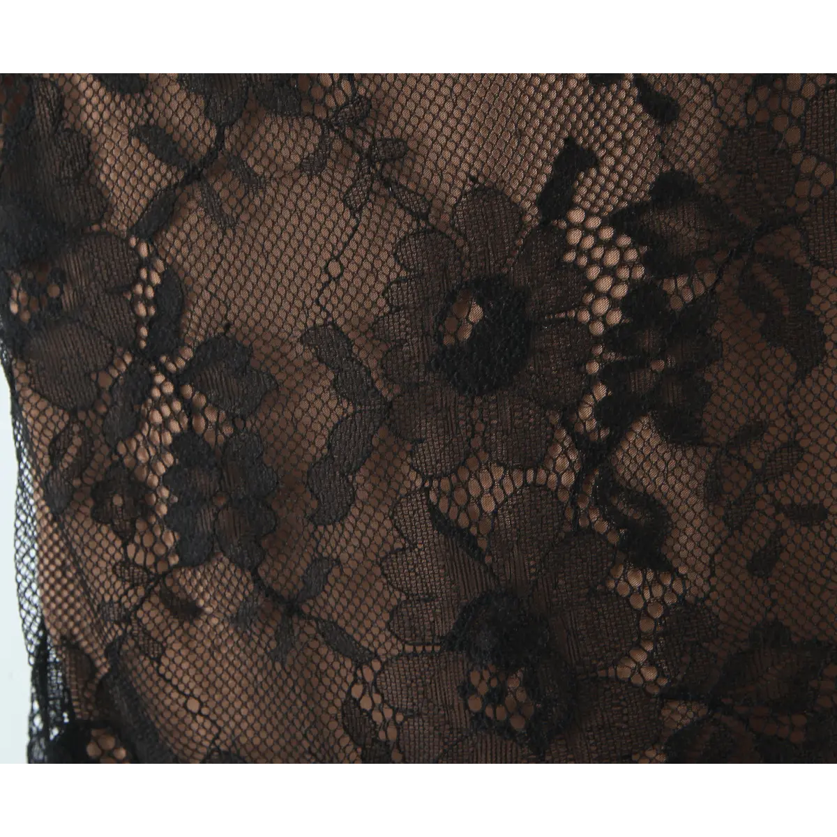 Close-up of the intricate floral lace pattern over the nude lining