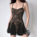 Lifestyle shot of model wearing the black lace babydoll slip dress, showing full silhouette, sheer floral lace, and flared skirt