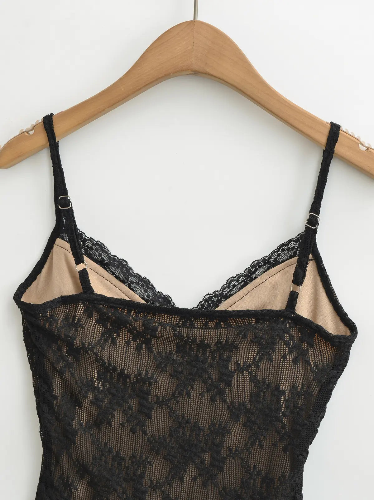 Black lace cami top, back view showing the silhouette and strap details