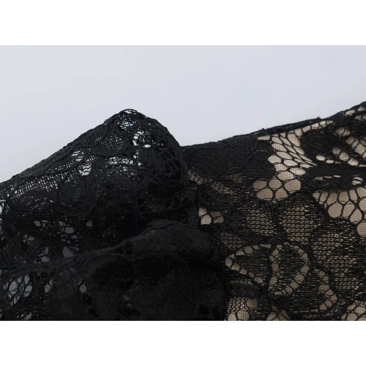 Close-up of black floral lace fabric texture
