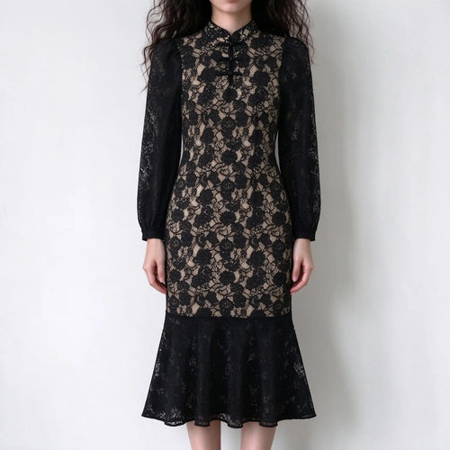 Model wearing black lace frog button mandarin collar midi dress, front view