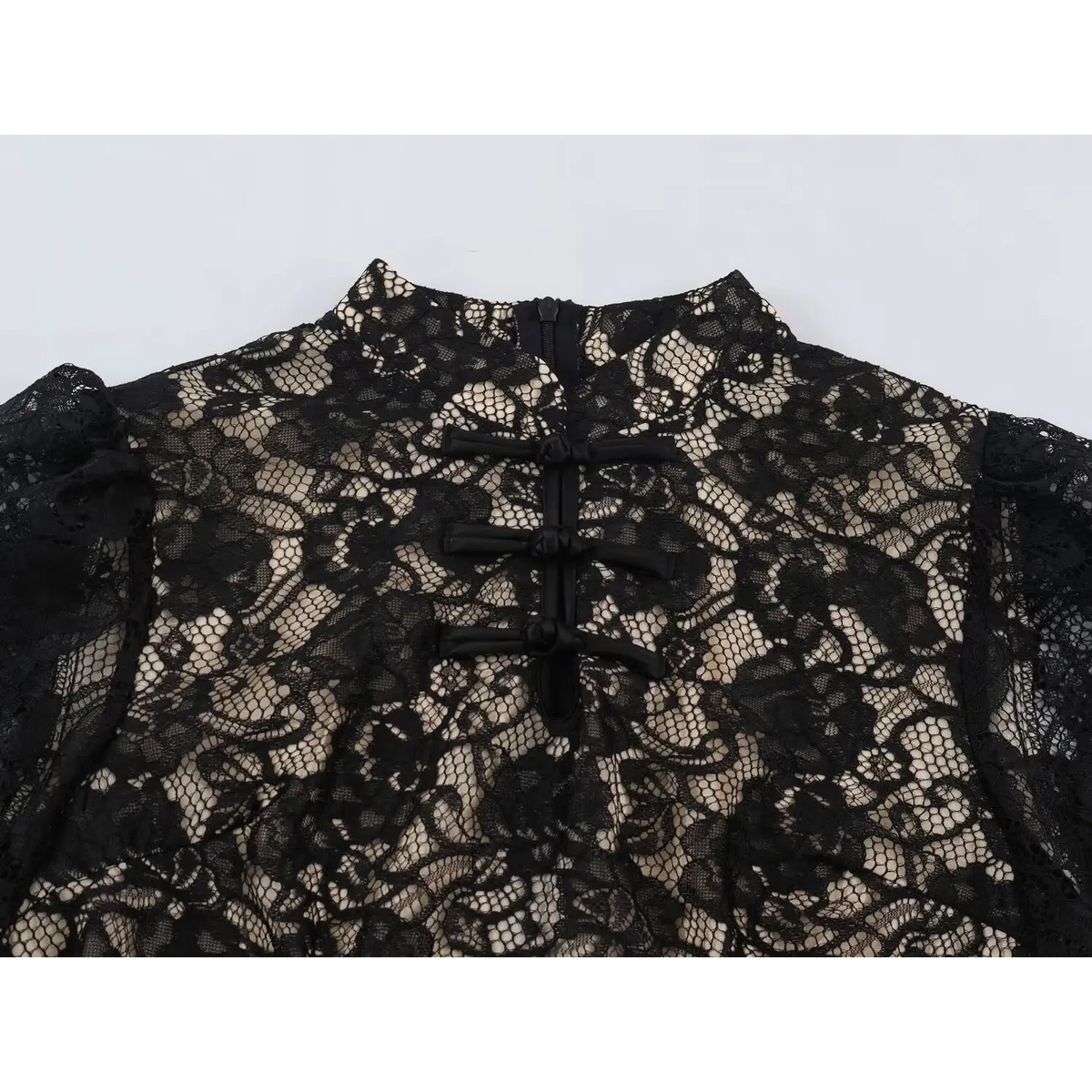 Close-up of mandarin collar, frog buttons and back zipper