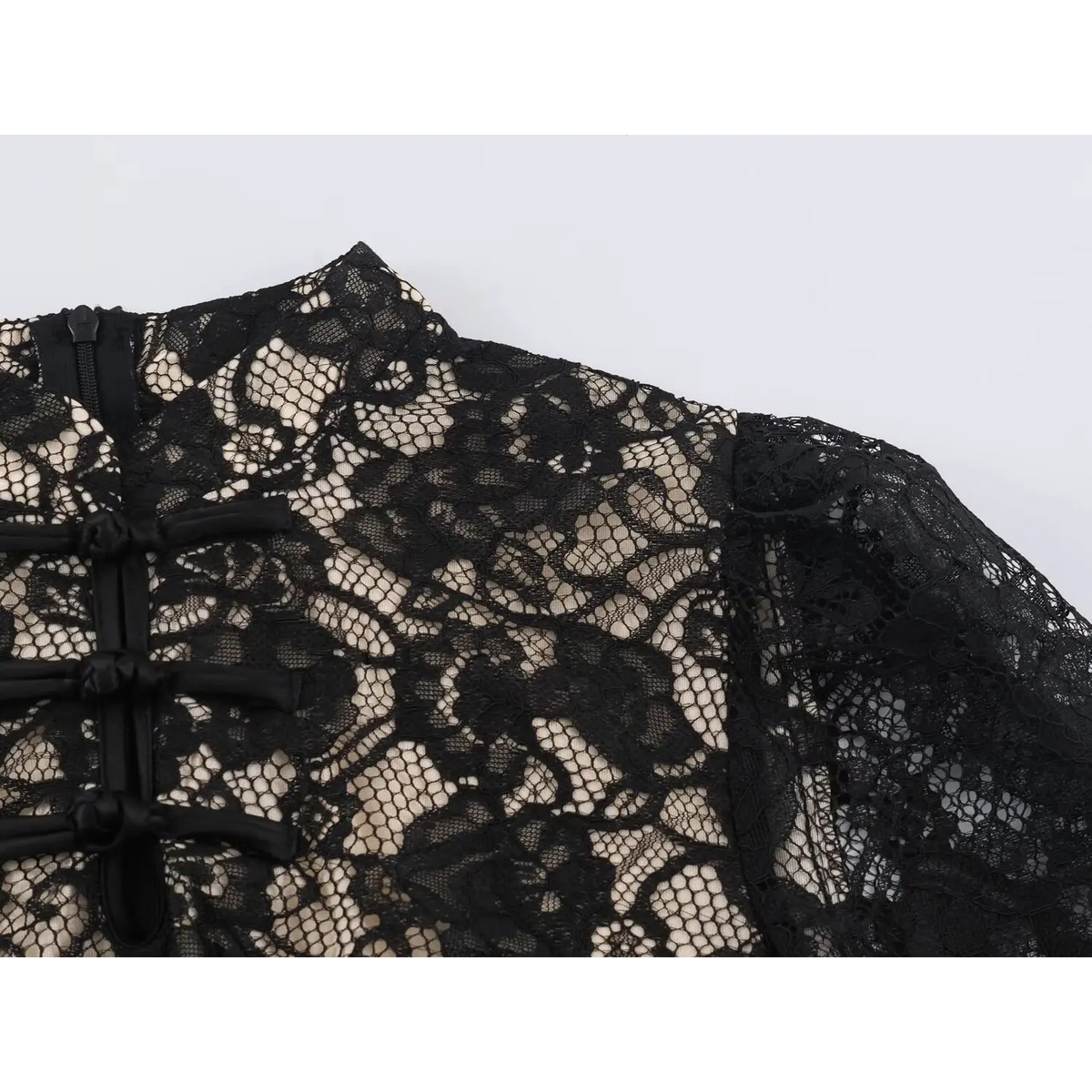 Close-up of shoulder seam and lace fabric