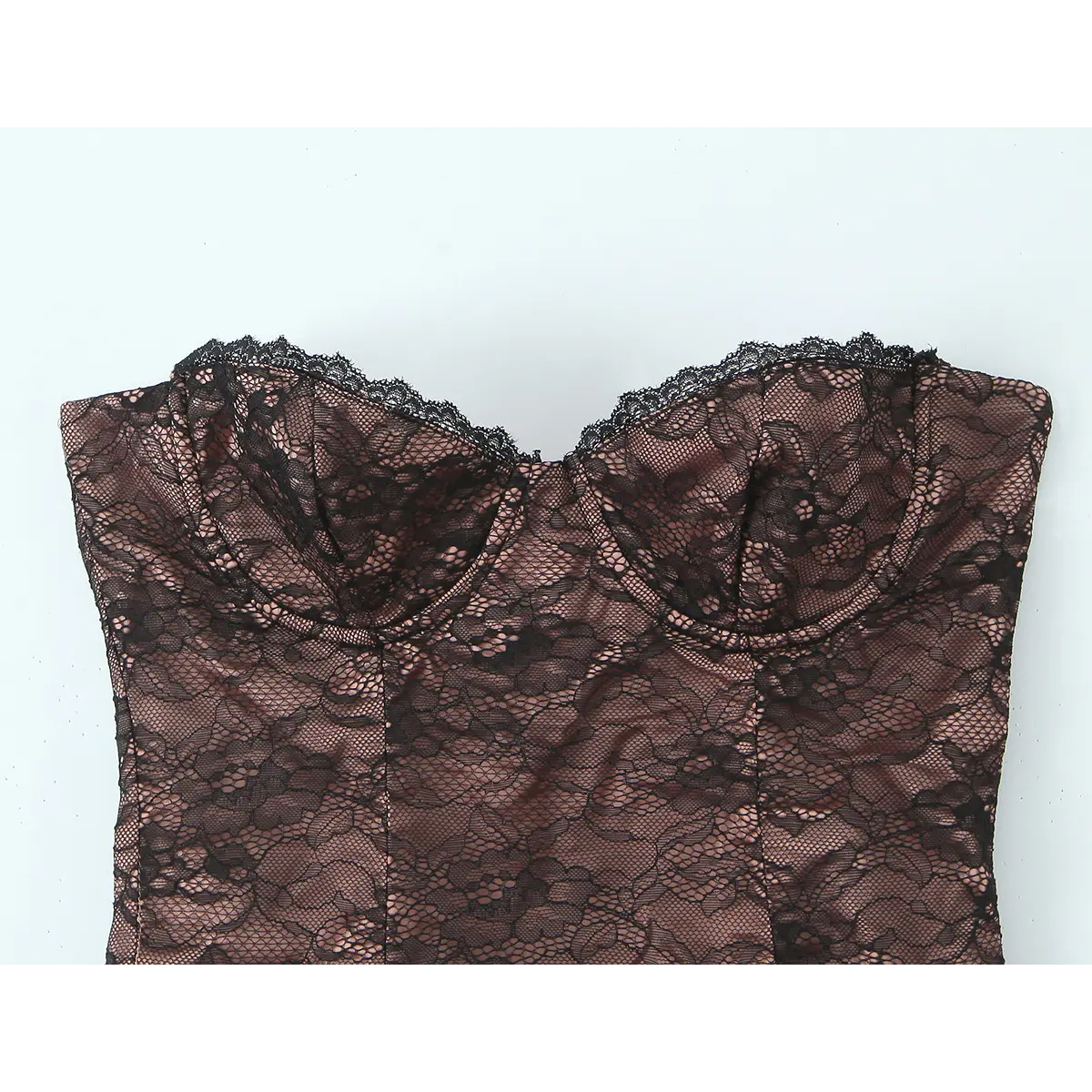 Full view of the sweetheart neckline with scalloped lace trim on the black bustier.