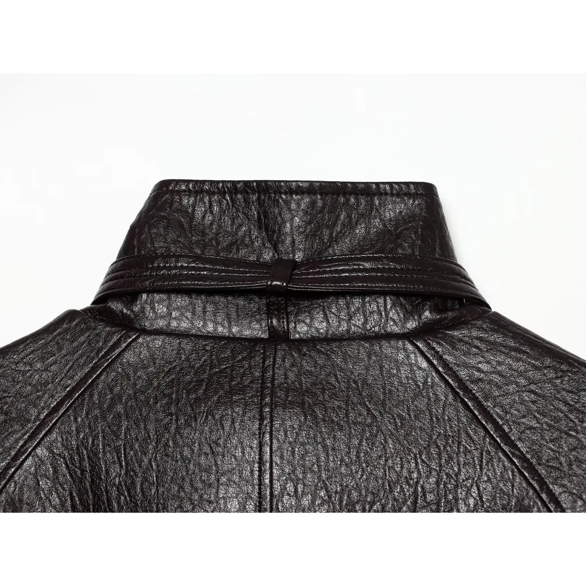Close-up of back stand collar and neck strap on black pebbled leather jacket