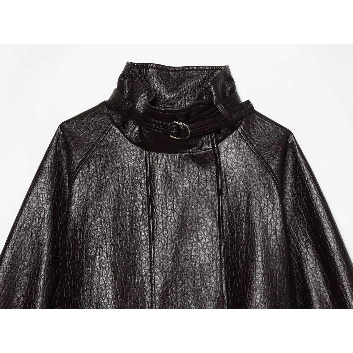 Close-up of stand collar with buckle neck strap on black pebbled leather jacket