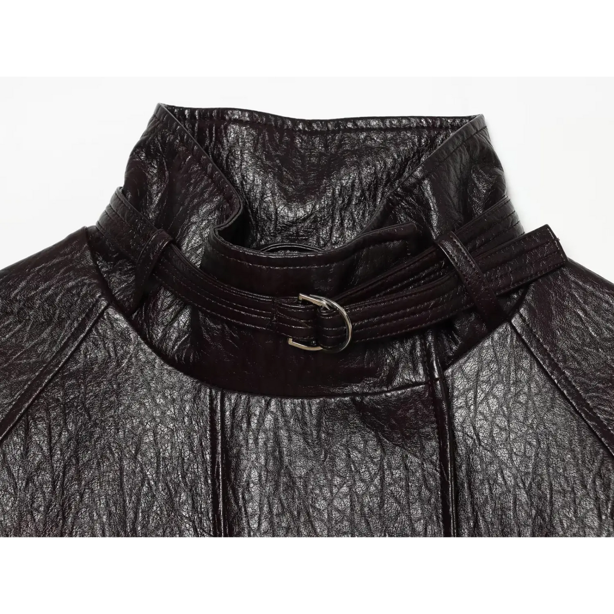 Close-up of metal ring buckle and leather neck strap on black jacket