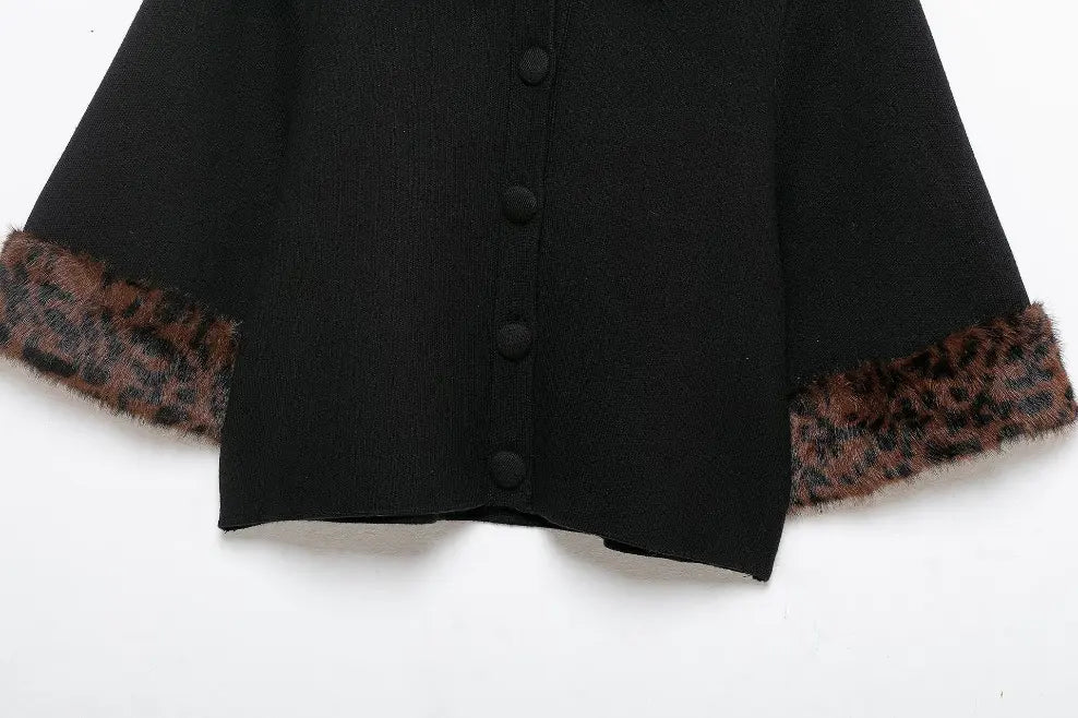 Close-up of cropped hem and leopard fur cuff