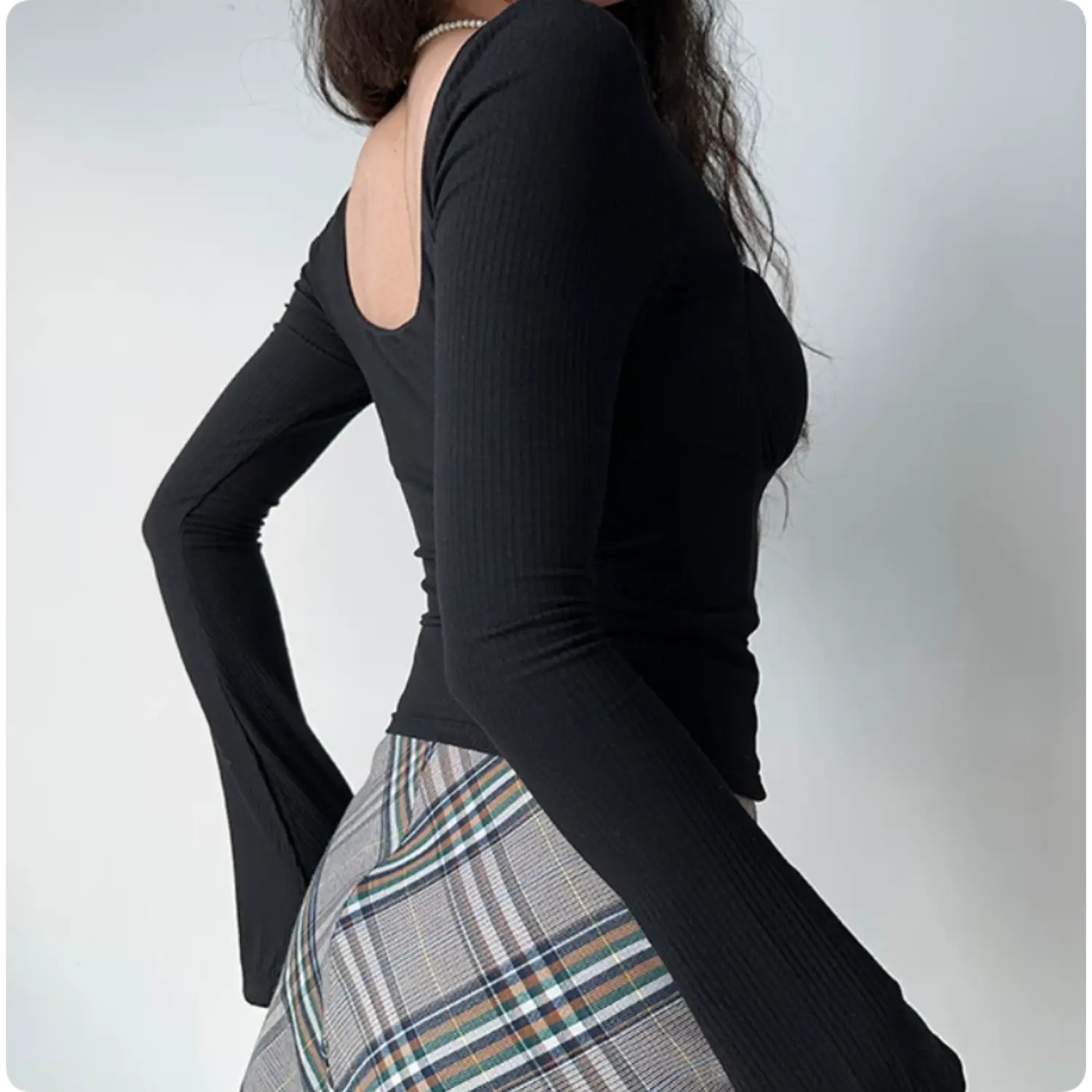 Low back view black ribbed square neck crop top, waist cinched slim fit flare long sleeve vintage women going out top
