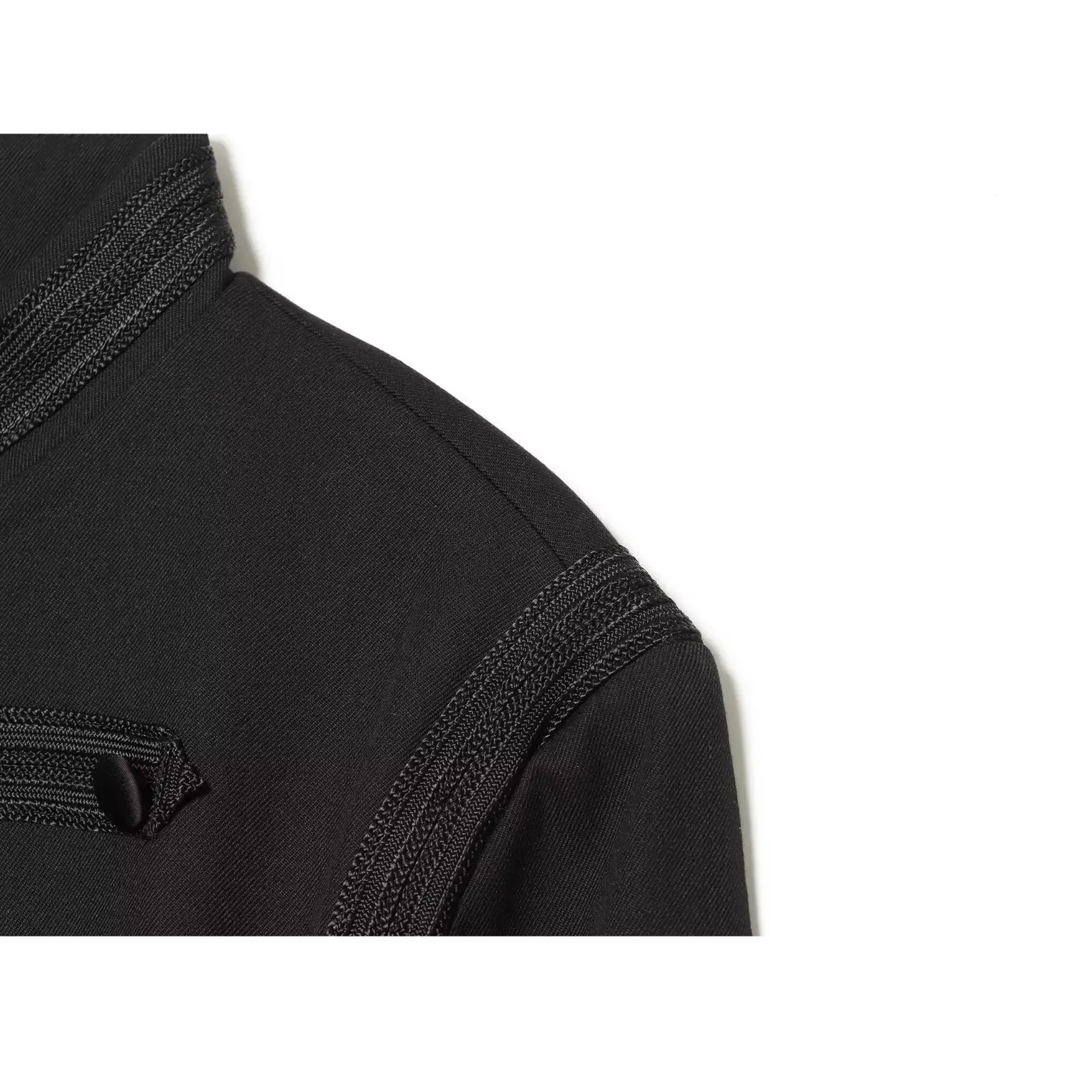 Close‑up view of shoulder braided embroidery trim detail on black cropped military jacket