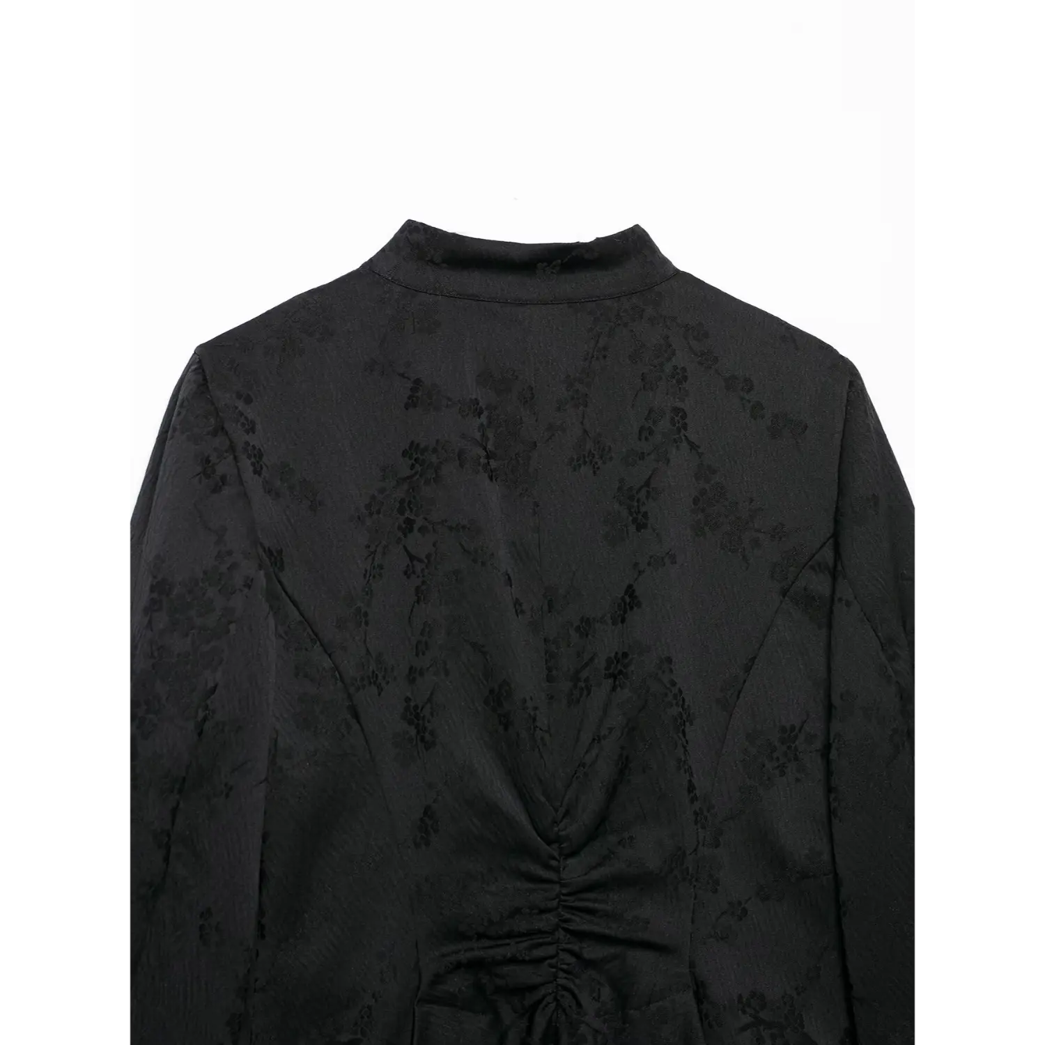 Back shoulder partial view of black new chinese cropped jacket, mandarin collar, floral jacquard pattern, back waist ruched detail, white background