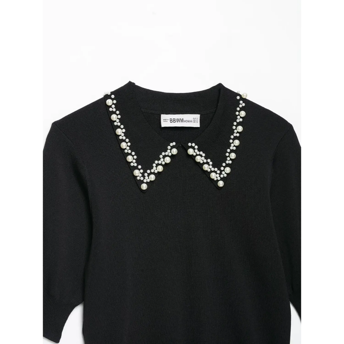 Close-up of pearl embellished peter pan collar