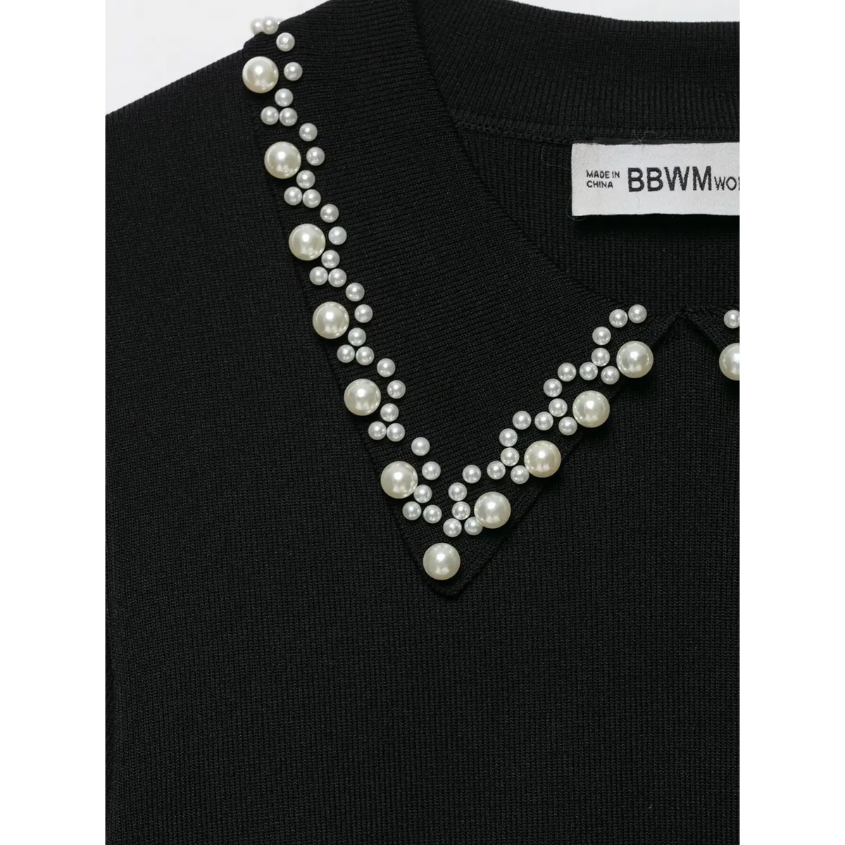 Close-up of pearl collar embellishment