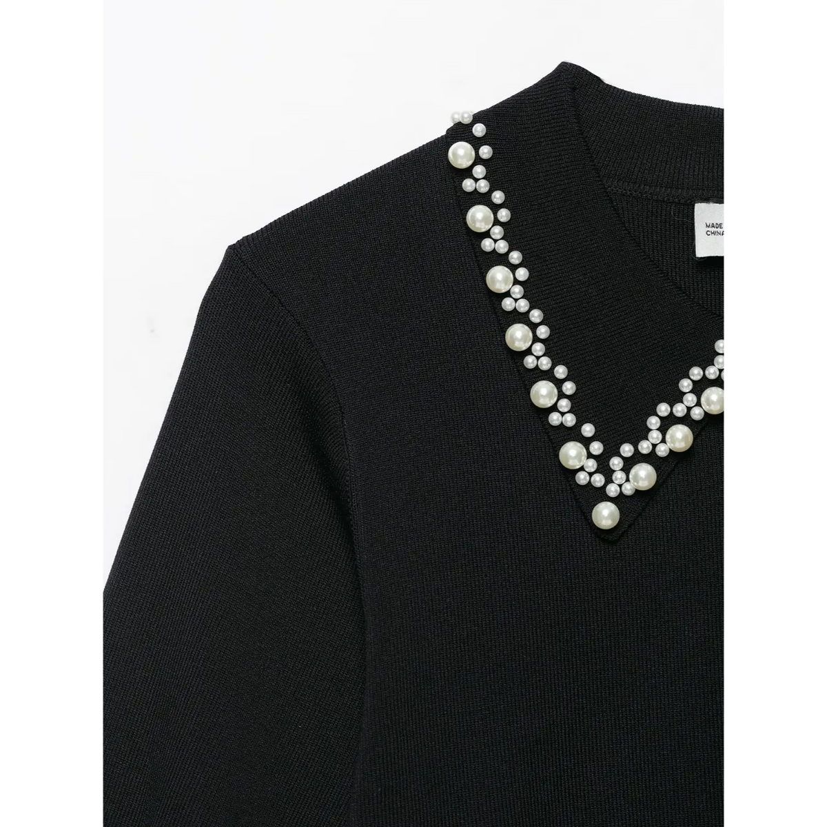 Close-up of pearl embellished collar detail