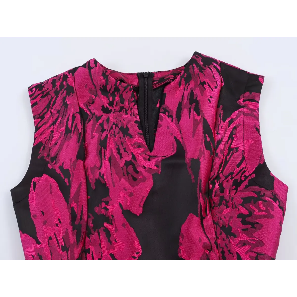 Front view of the black and pink floral jacquard sleeveless dress, showing the V-neckline with back zipper and bold floral pattern