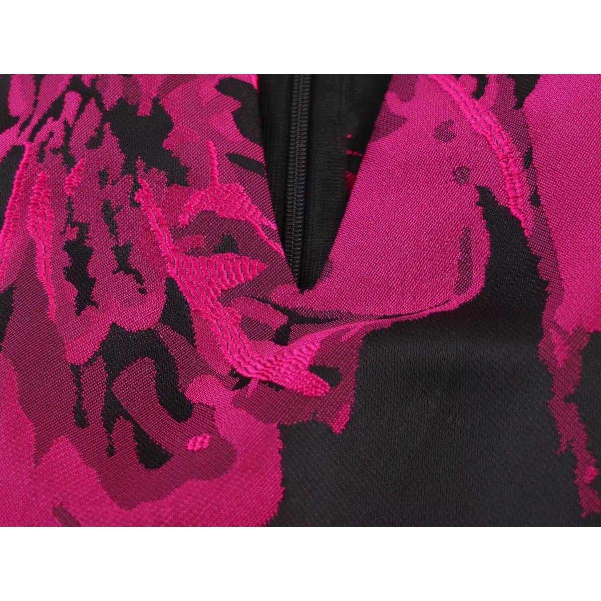 Close-up of the dress hem, showing the finished stitching and contrasting pink lining