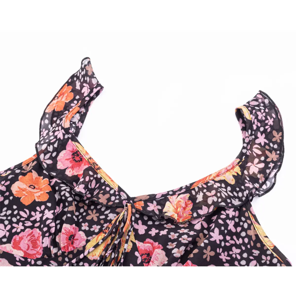 Close-up of the V-neckline, highlighting the ruffled shoulder straps and front tie.