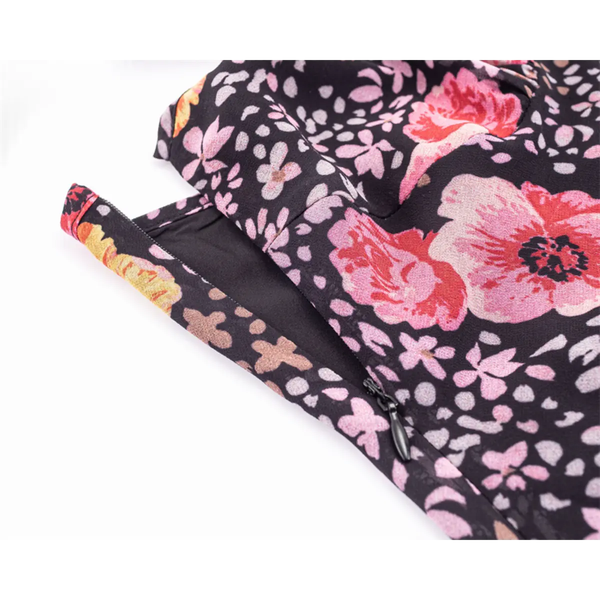 Close-up of the side-seam zipper with a matching fabric pull tab.