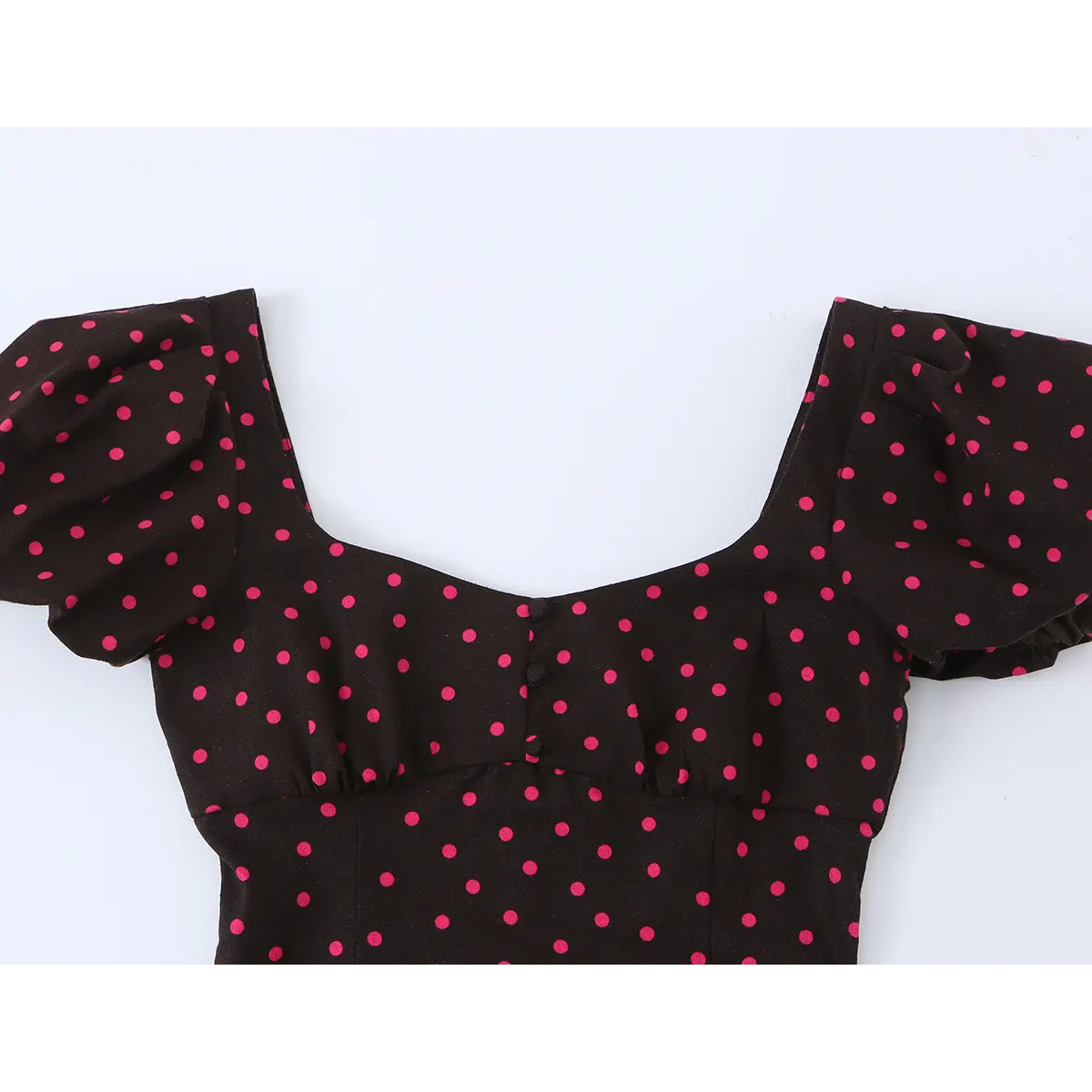 Close-up of the dress's front bodice, highlighting the sweetheart neckline, center buttons, and fitted construction.