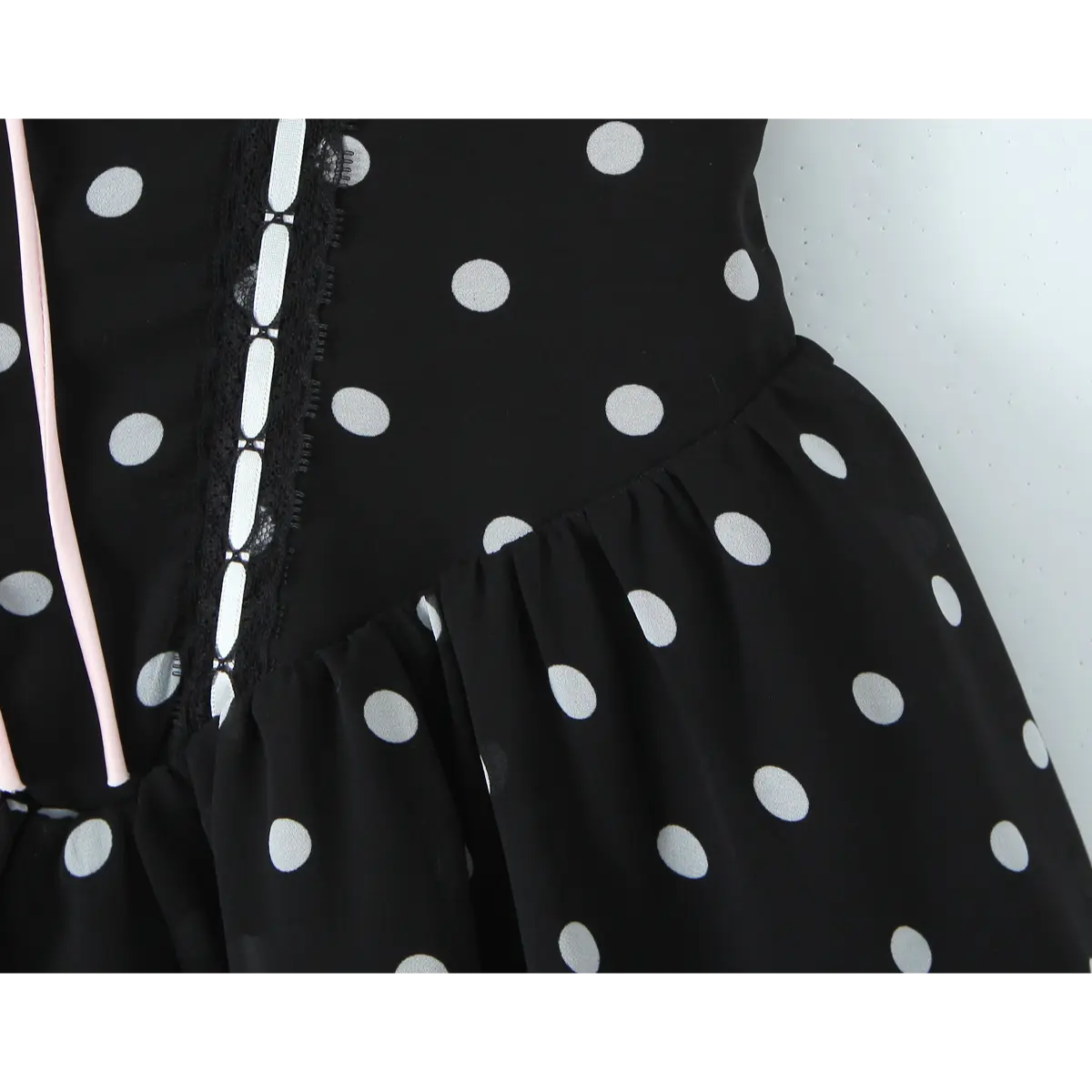 Close-up of the waist seam where the fitted bodice transitions into the gathered chiffon skirt.