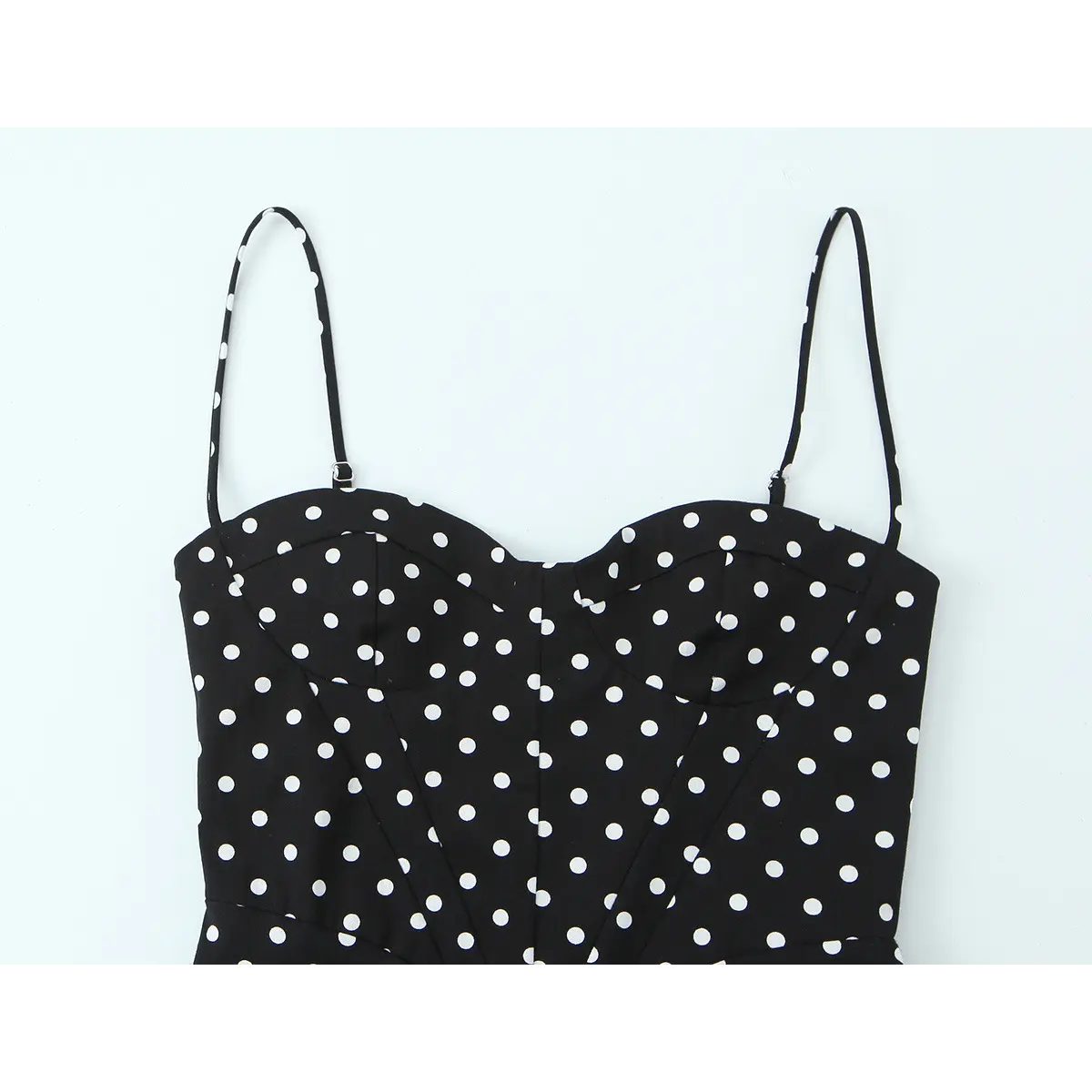 Close-up of the dress's sweetheart bust area, showing structured cups, princess seams, and adjustable spaghetti straps.