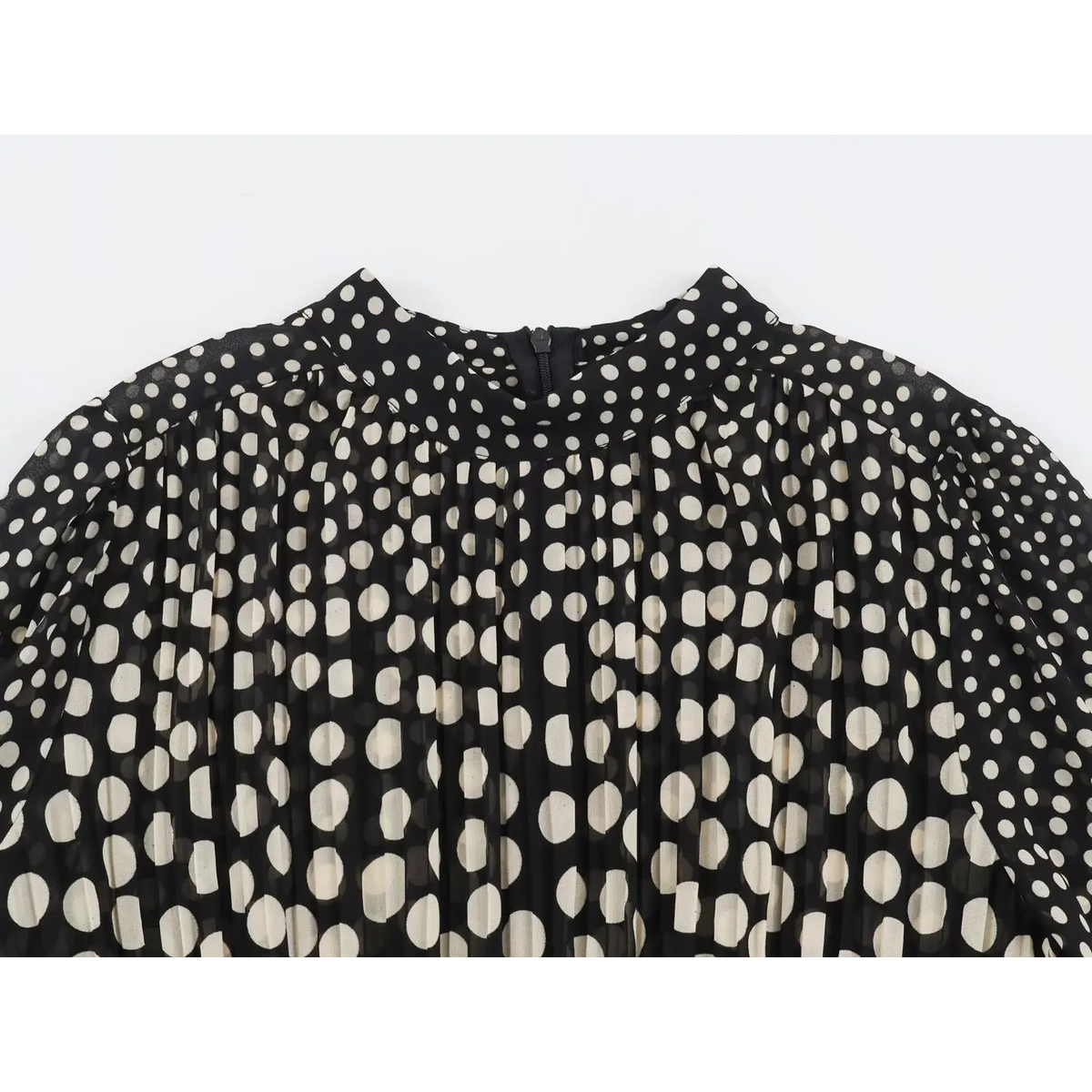 Close-up of high neckline and back zipper on black polka dot chiffon maxi dress