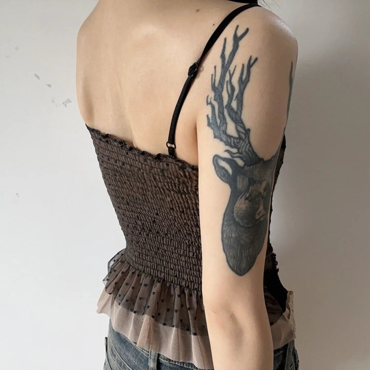 Black polka dot mesh lace cami tank back close-up shot, thin adjustable straps full smocked back double dot mesh ruffle hem slim cropped camisole