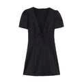 Flat lay front view of black mini dress, deep V neck, front bow, puff short sleeves, white background