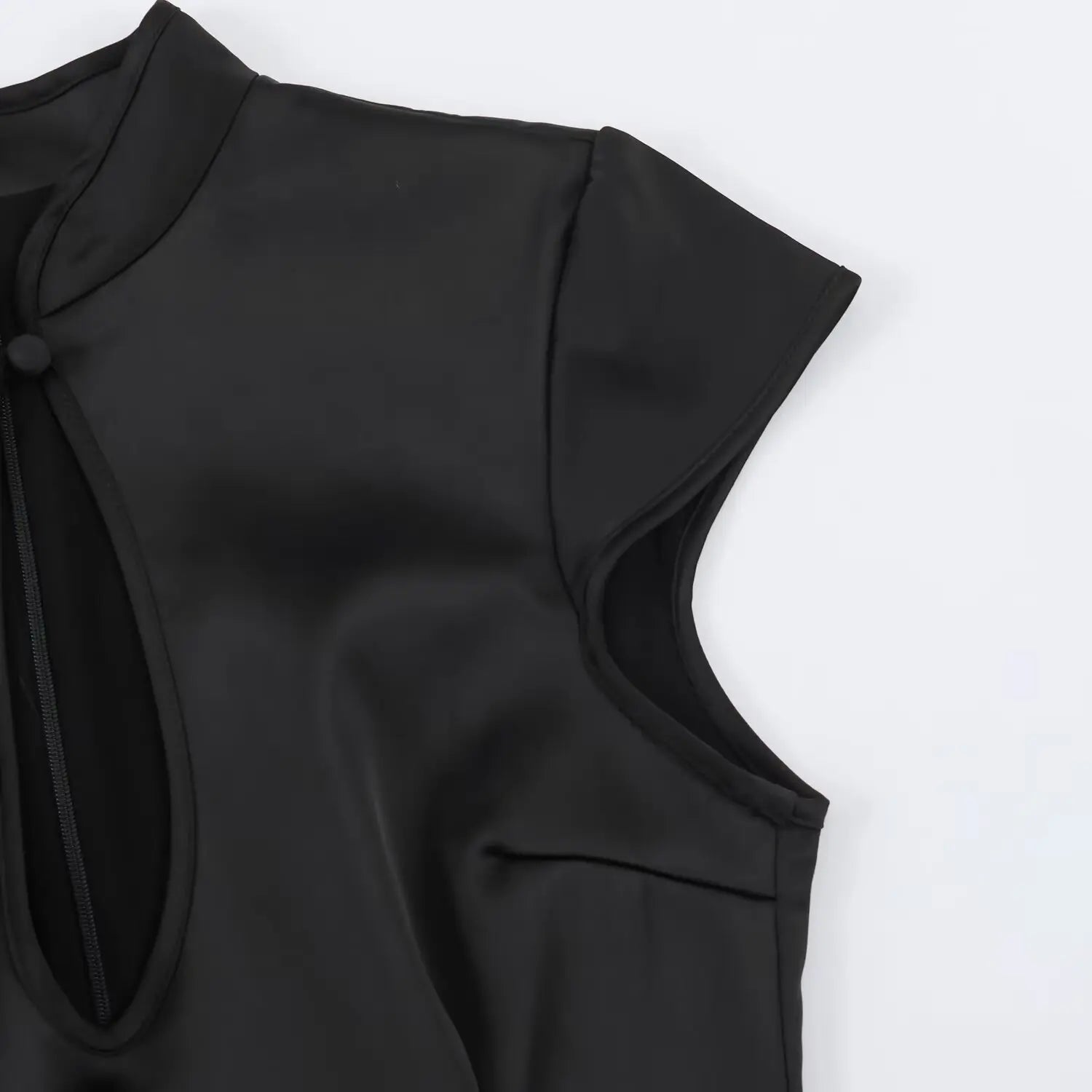 Black satin qipao partial shot, mandarin stand collar, cap short sleeve edge, hollow chest cutout outline stitching