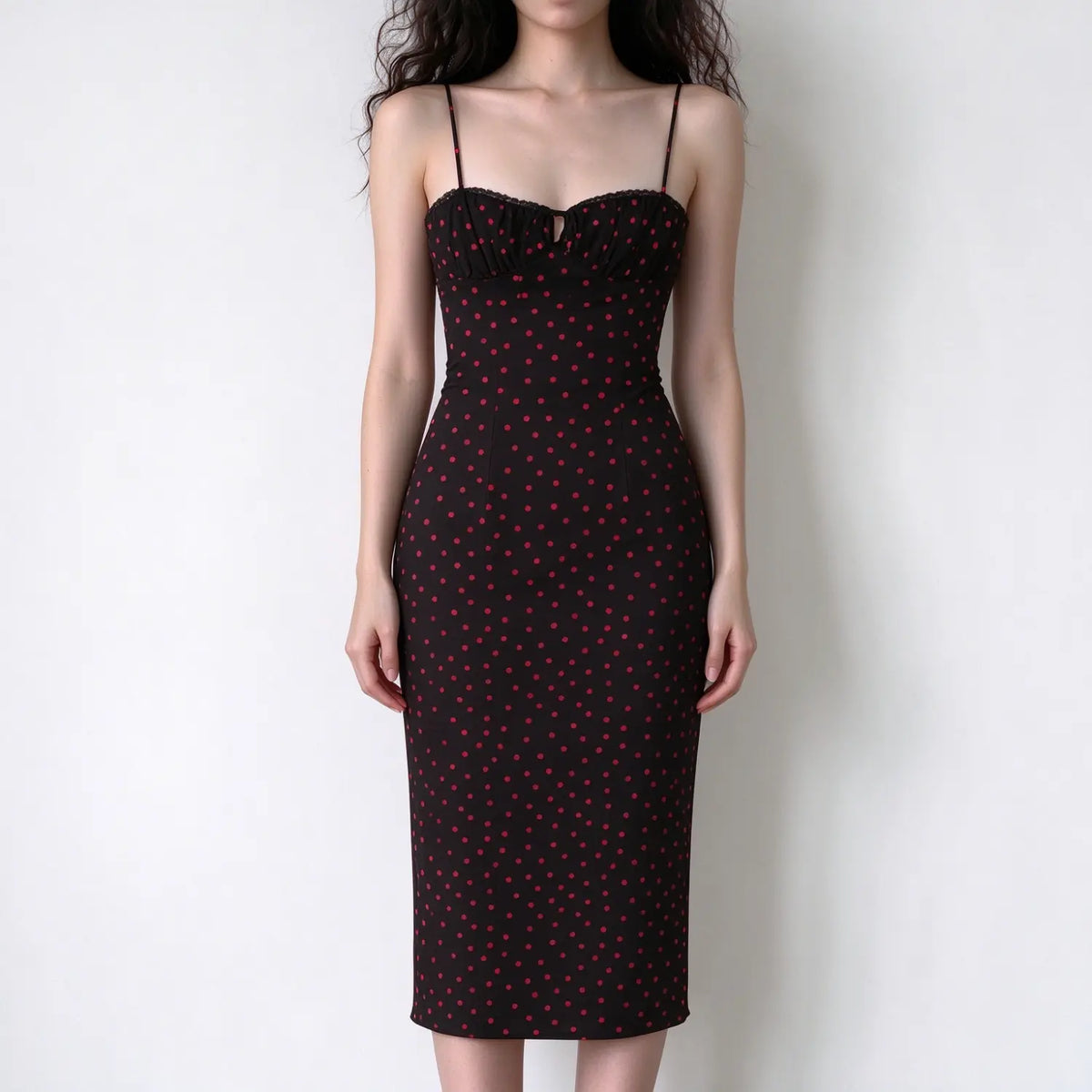 Model wearing black red polka dot spaghetti strap maxi dress, sweetheart neckline, lace trim detail, bodycon fitted silhouette