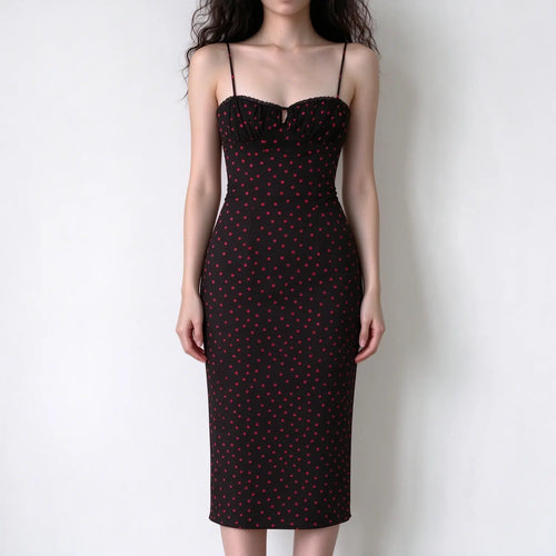 Model wearing black red polka dot spaghetti strap maxi dress, sweetheart neckline, lace trim detail, bodycon fitted silhouette