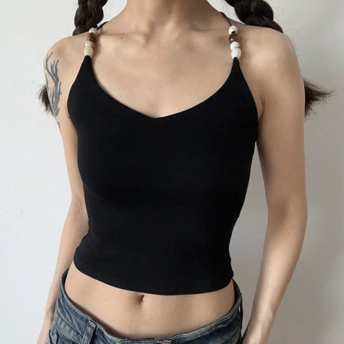Lifestyle shot of black ribbed camisole with beaded straps and crisscross back