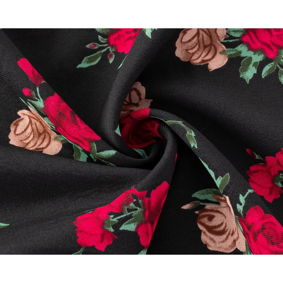 Close-up of the red and pink rose print on the black halter dress fabric, showing texture and print clarity.