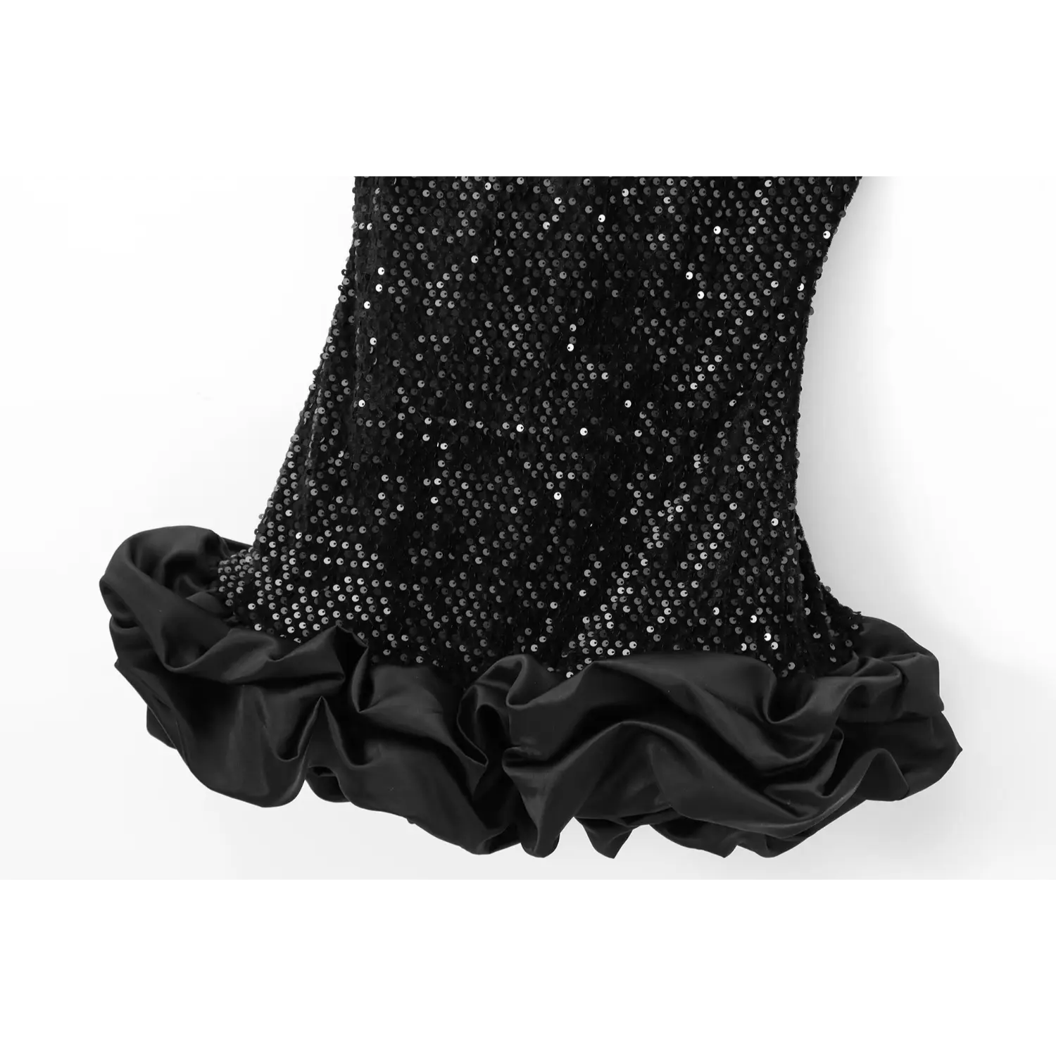 Partial view of the dress showing the sequin body and full satin ruffled hem