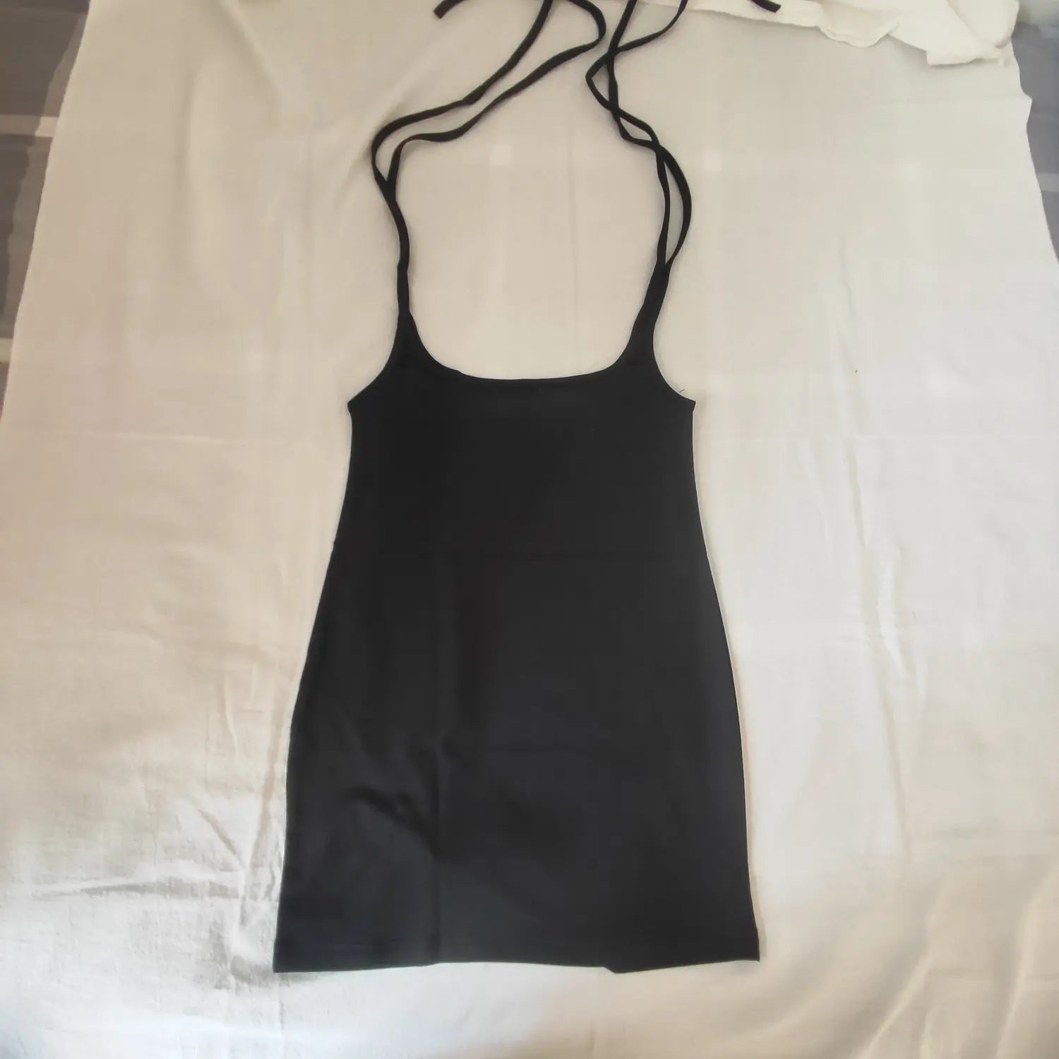 Flat lay full front view black tie suspender waist cutout bodycon mini skirt