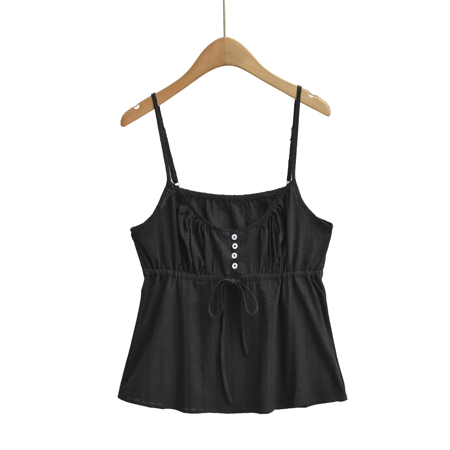 Front view of a black textured camisole top on a wooden hanger, showing the button placket and drawstring