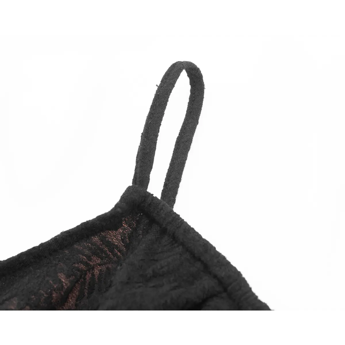 Close-up of the thin spaghetti strap made from the same textured fabric.