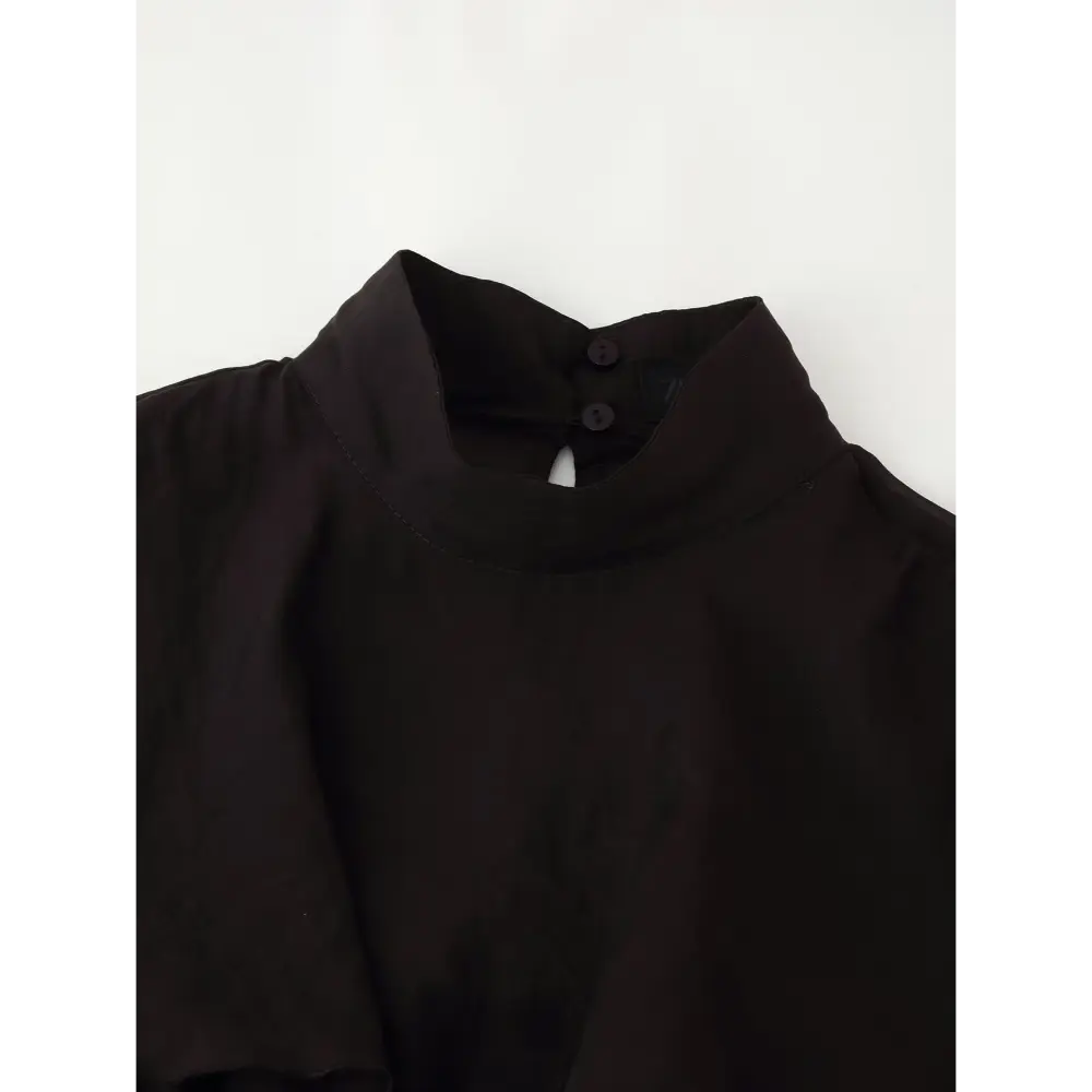 Close-up of back neck button closure and keyhole