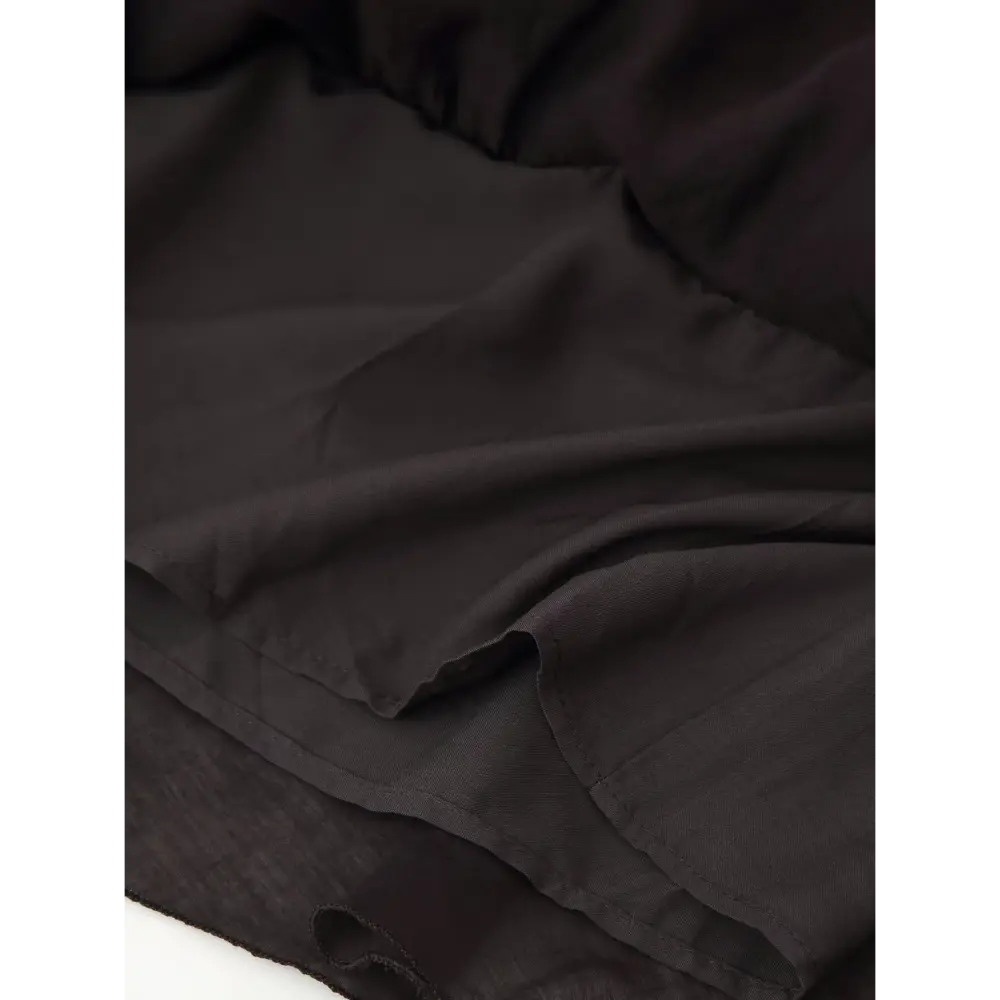 Close-up of lined skirt hem and chiffon layers