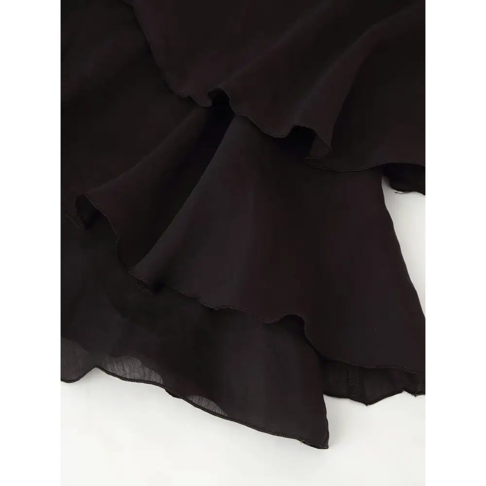 Close-up of layered ruffle skirt and sheer chiffon hem