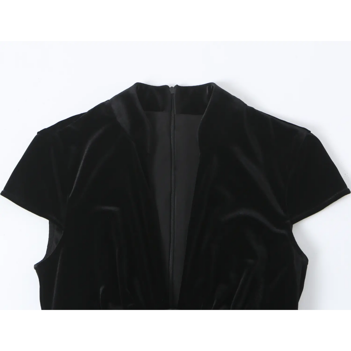 Close-up of mandarin collar, deep V neckline and back zipper