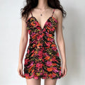 Studio model front full view deep v neck adjustable spaghetti strap all‑over floral ruched bodycon mini dress