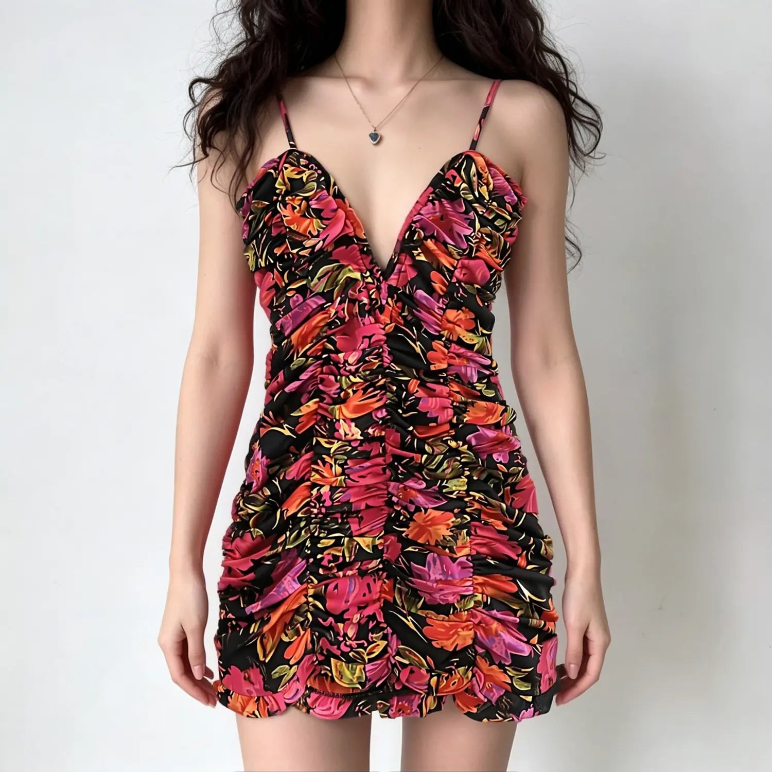 Studio model front full view deep v neck adjustable spaghetti strap all‑over floral ruched bodycon mini dress